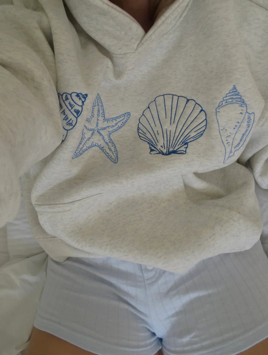 Marigold | Unisex sweatshirt with seashells