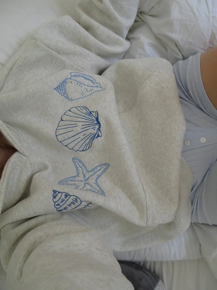 Marigold | Unisex sweatshirt with seashells